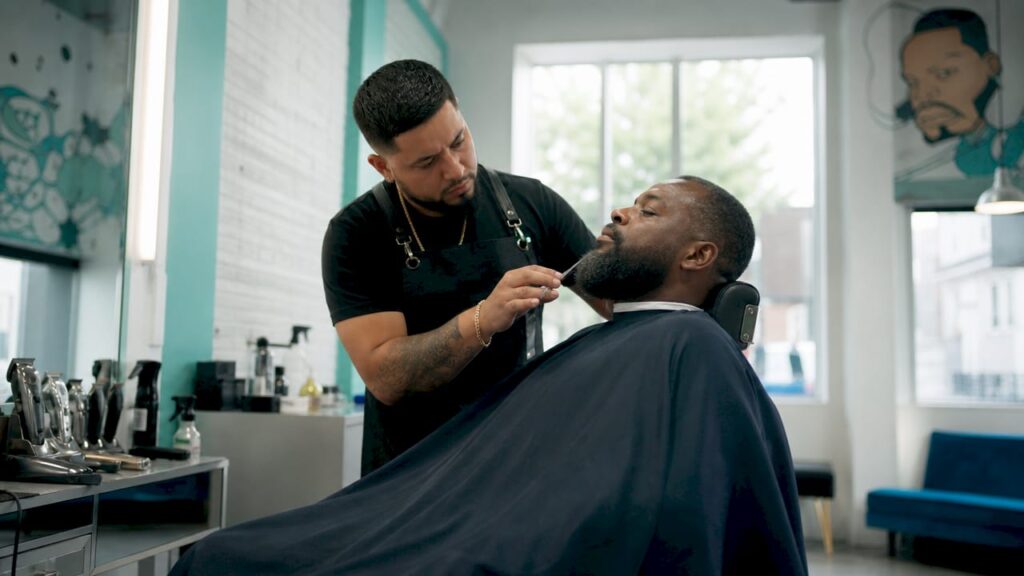 Man receiving premium haircut at local barbershop