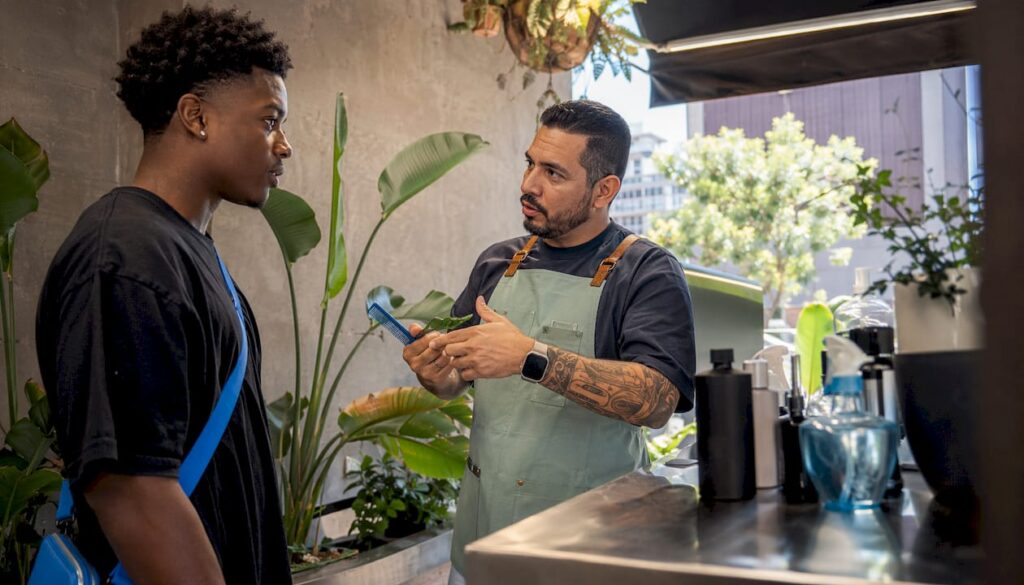 Client and barber discussing haircut style
