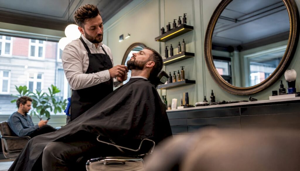 Interior of classic Copenhagen barbershop with barber working
