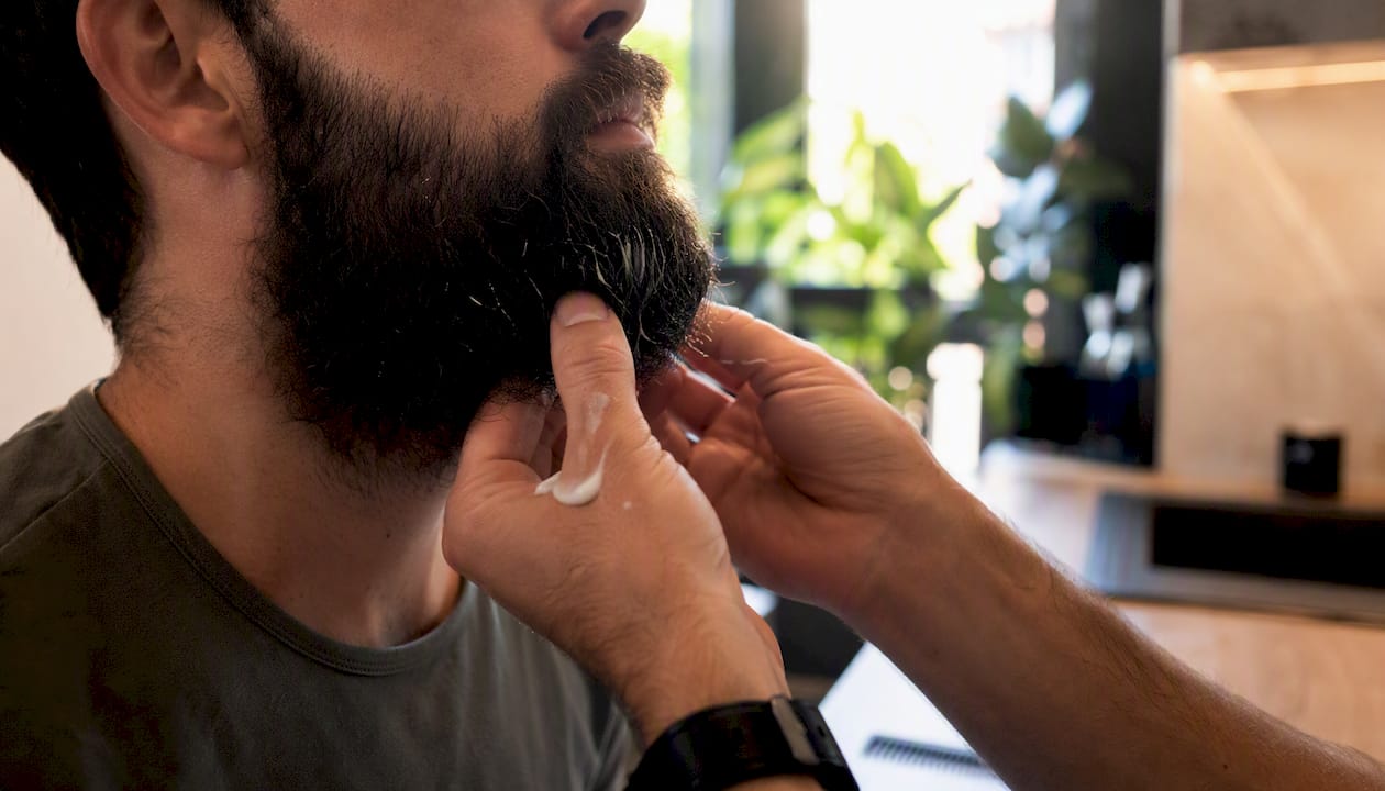Man conditioning relaxed statement beard