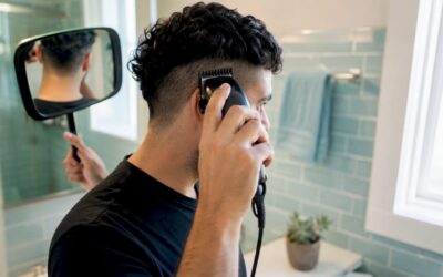 Man trimming undercut hair at home