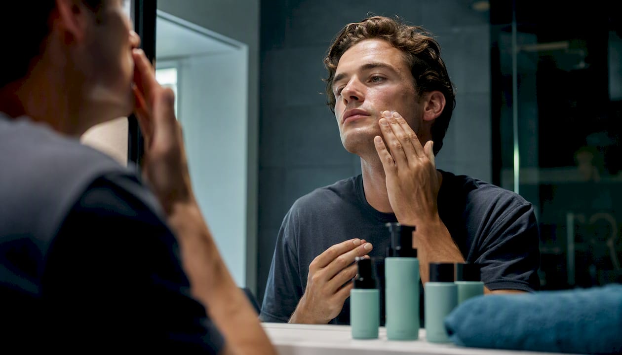 Man applying moisturizer for Scandinavian grooming